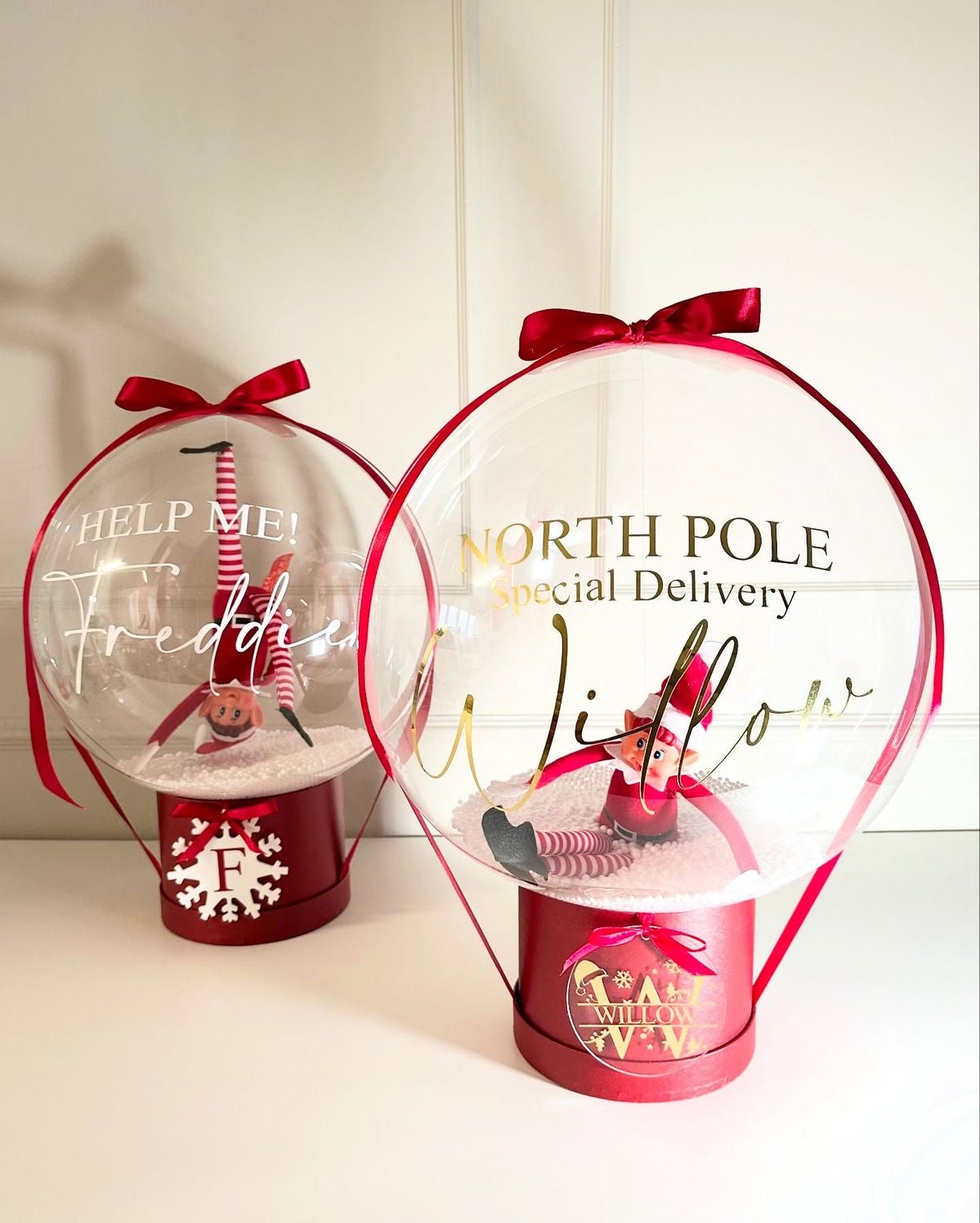 Snowglobe-style balloon with elf toy and custom name print — unique personalized Christmas surprise