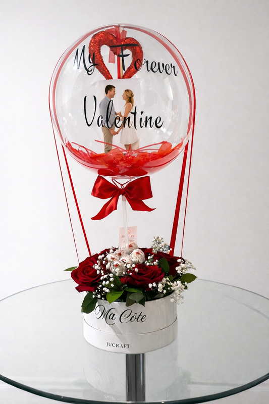 Personalized photo bobo balloon with floral base displayed as a romantic gift arrangement