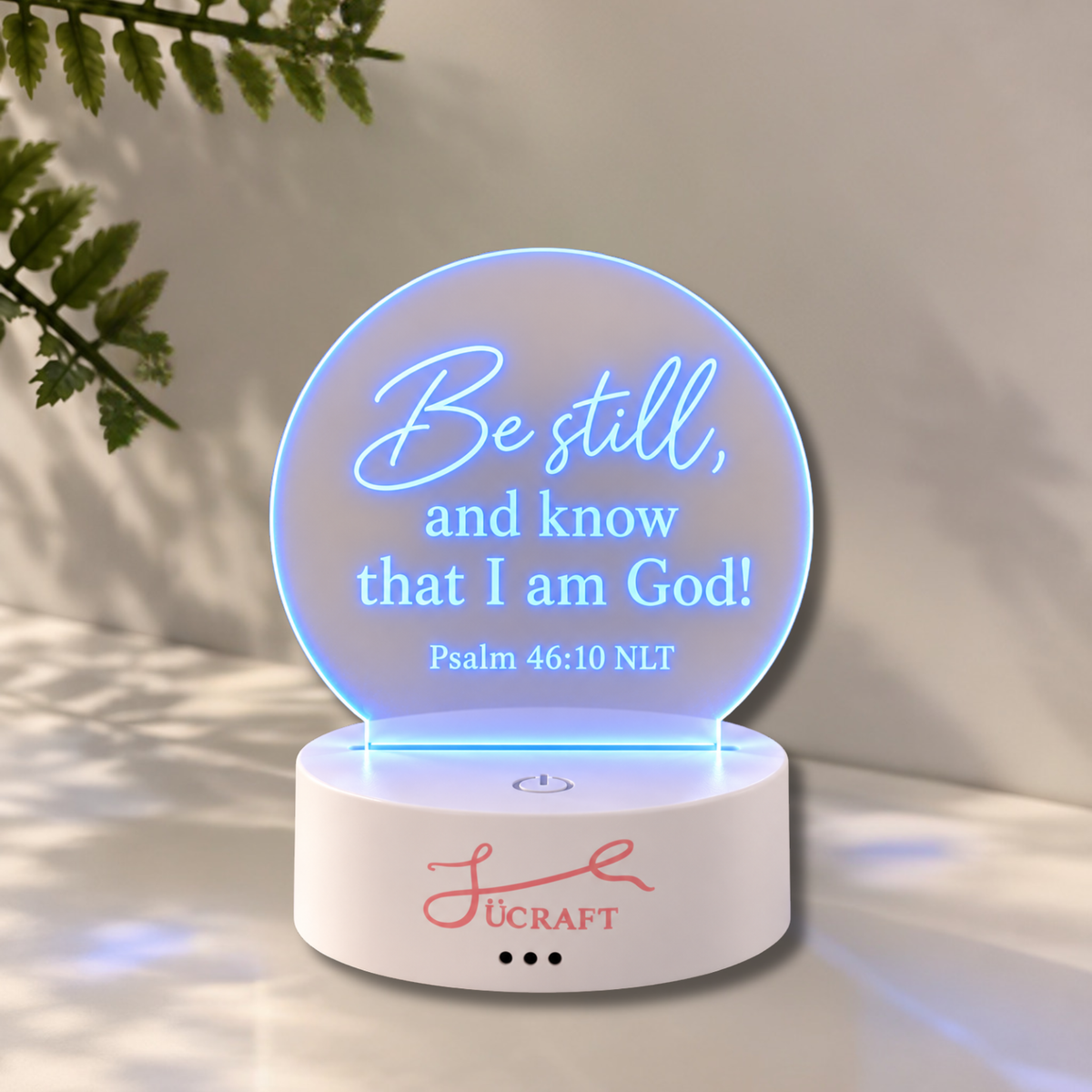 Bible verse night light glowing on a bedside table