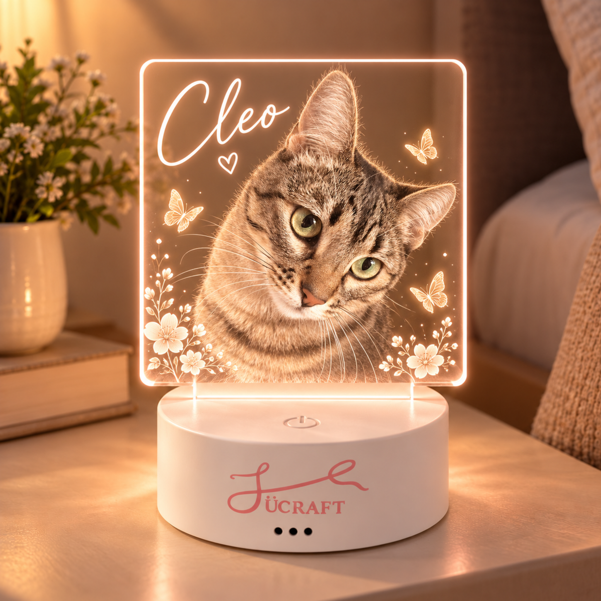 Custom pet night light lit up on a bedside table